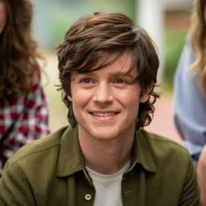 Harry Styles Haircuts with side swept bangs